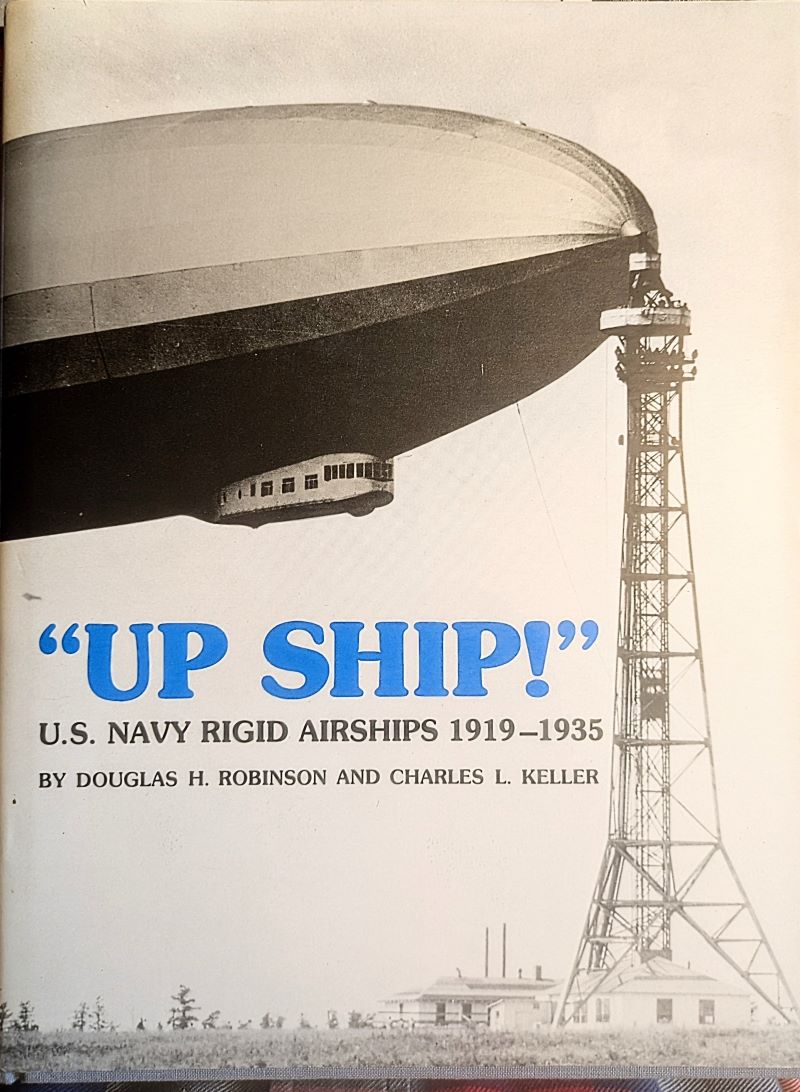 Picture of book cover showing front half of an airship attached to its tall mooring mast.